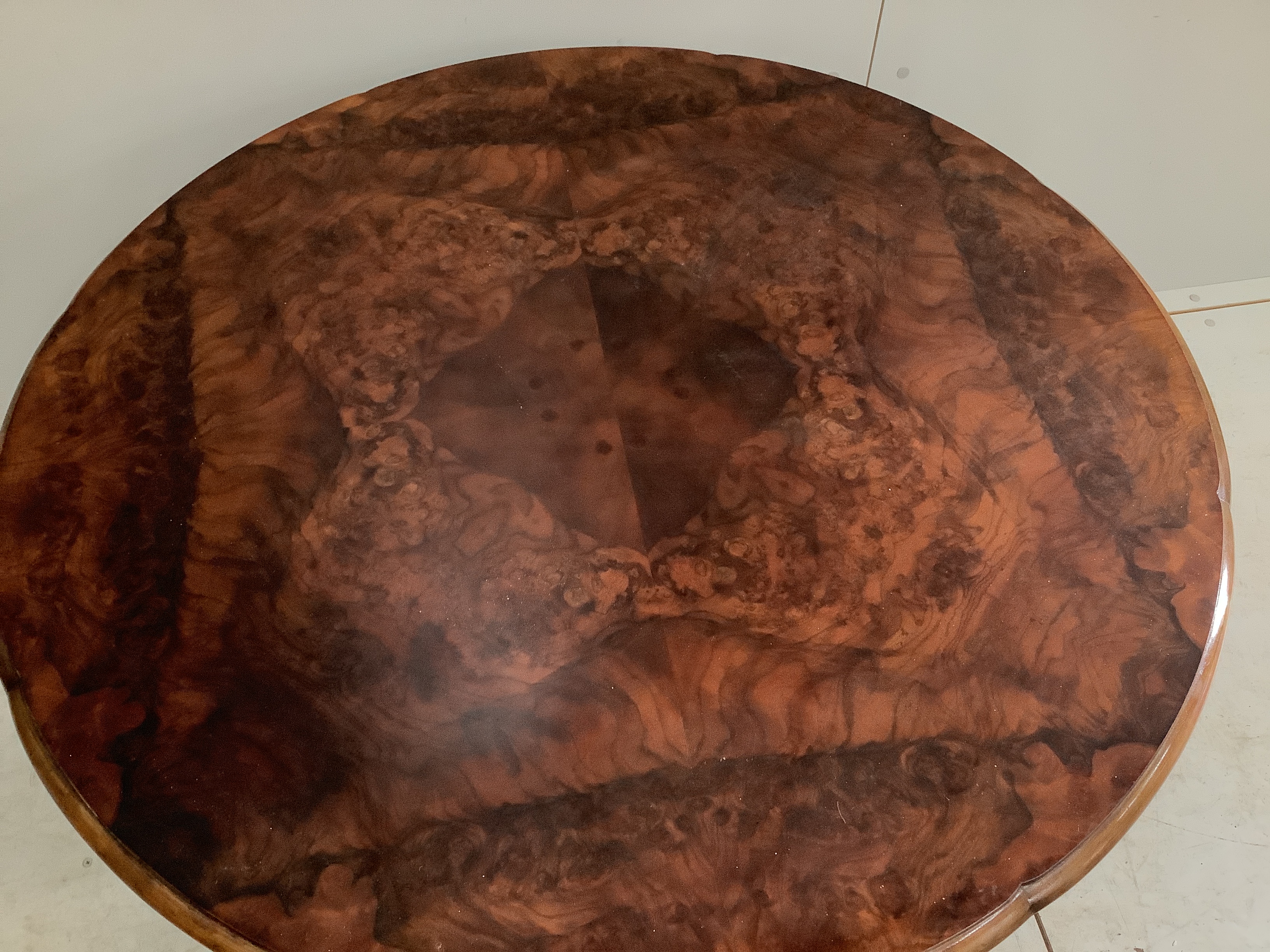 An early 20th century Continental figured walnut circular coffee table, diameter 98cm, height 57cm